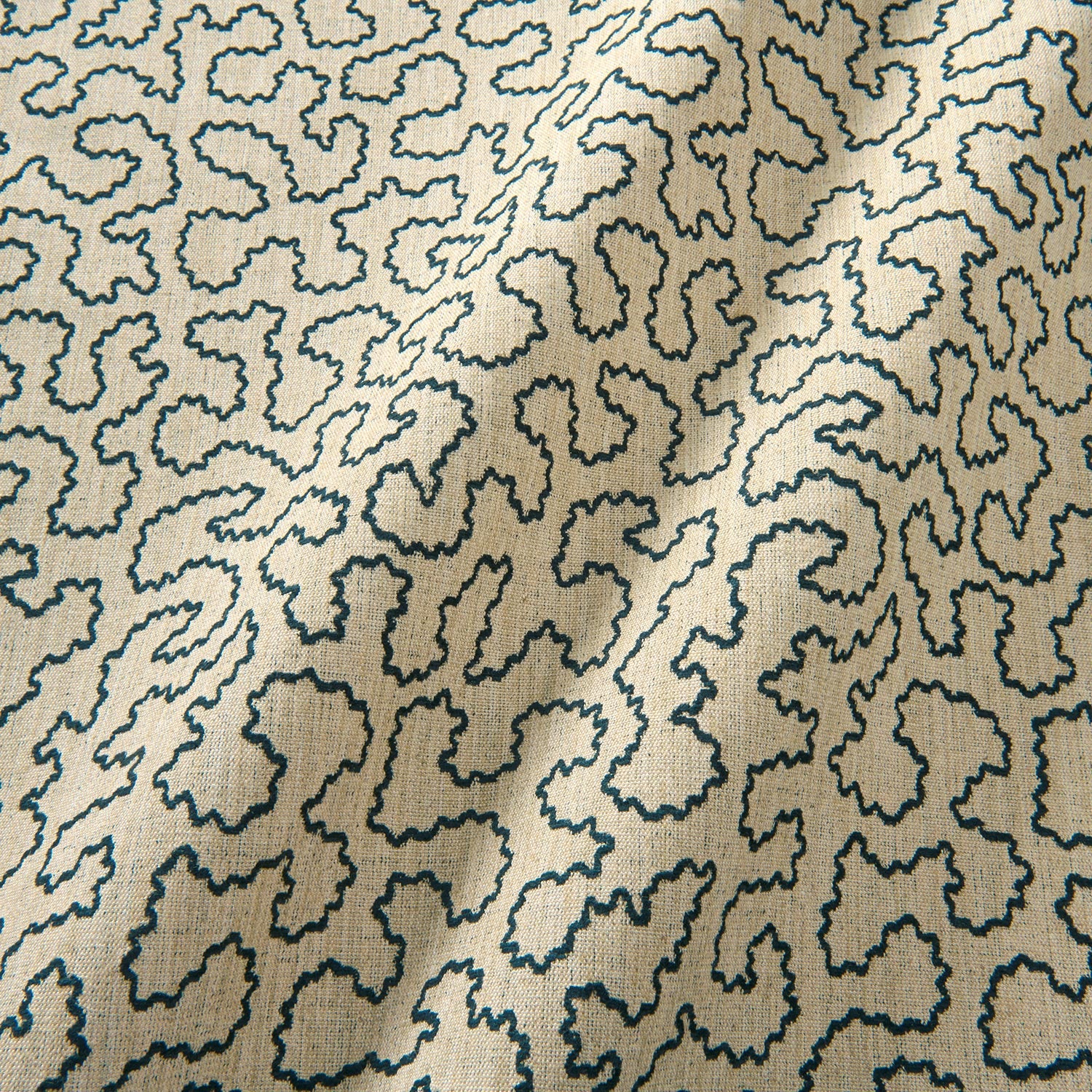 A woven fabric sample in black and beige featuring a wavy pattern.