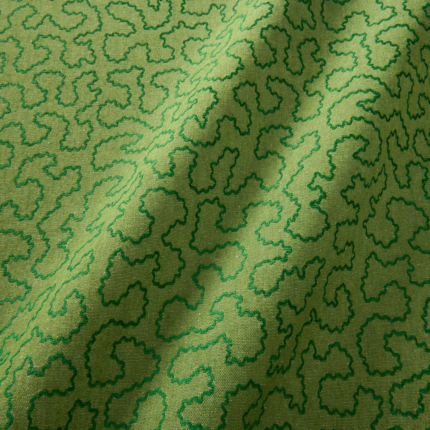 A woven fabric sample in green featuring a wavy pattern.