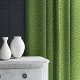 Curtain in green woven fabric featuring a wavy pattern.