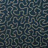 A woven fabric sample in blue and off-white featuring a wavy pattern.