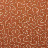 A woven fabric sample in orange and off-white featuring a wavy pattern.