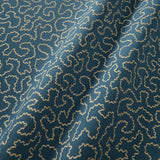A woven fabric sample in blue and off-white featuring a wavy pattern.