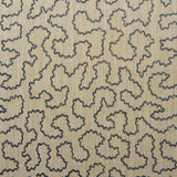 A woven fabric sample in blue and beige featuring a wavy pattern.