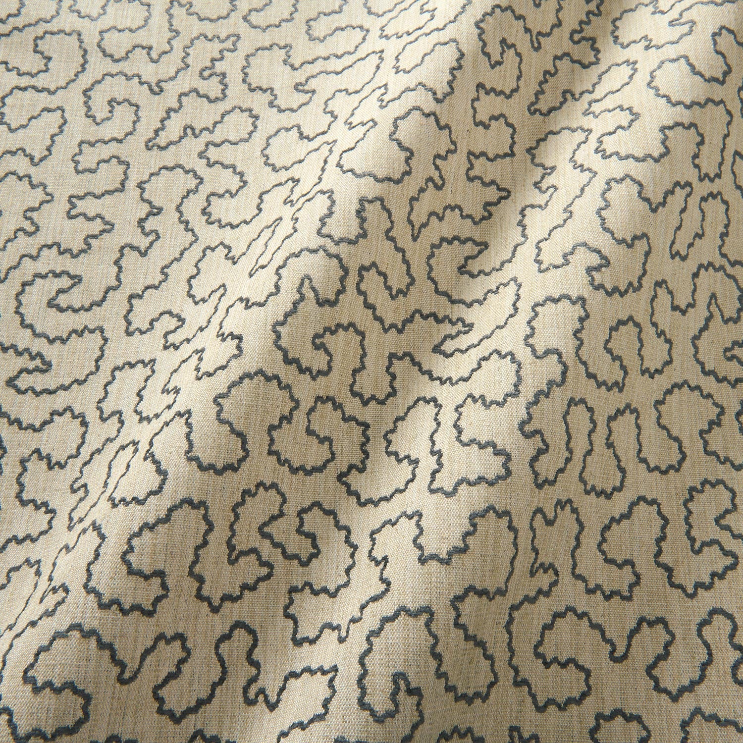 A woven fabric sample in blue and beige featuring a wavy pattern.