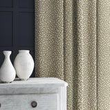 Curtain in blue and beige woven fabric featuring a wavy pattern.
