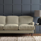 Sofa upholstered in a blue and beige woven fabric featuring a wavy pattern.
