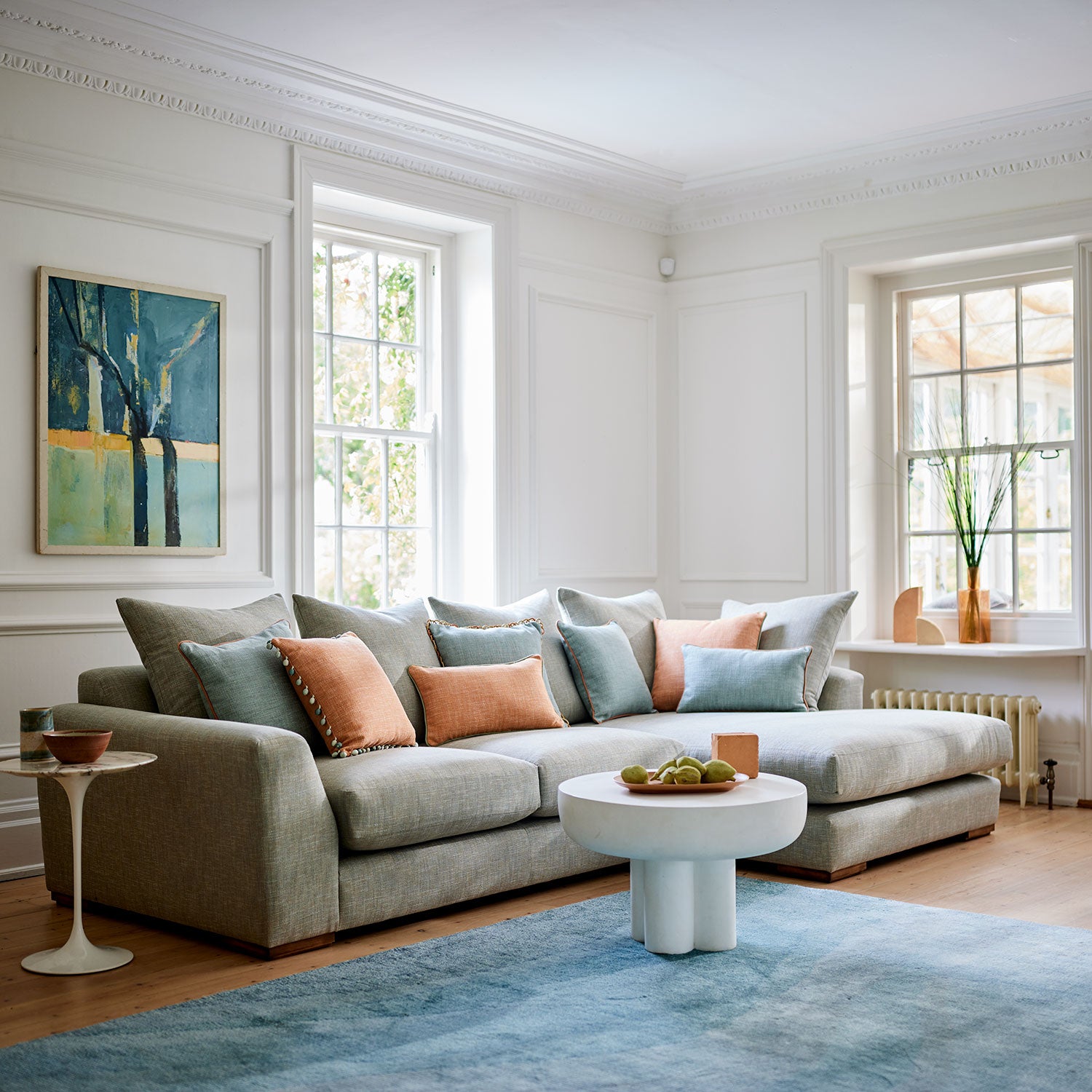 Blue sofa upholstered in a versatile woven fabric.