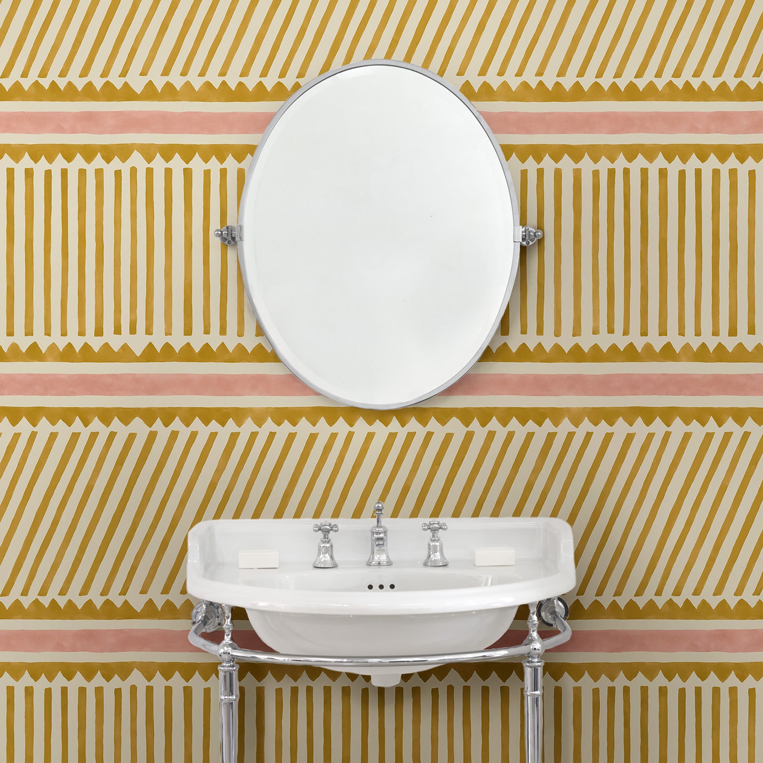 Cloakroom with playful gold and pink wallpaper with a combination of tonal stripes, zigzags, and matching colour bands.