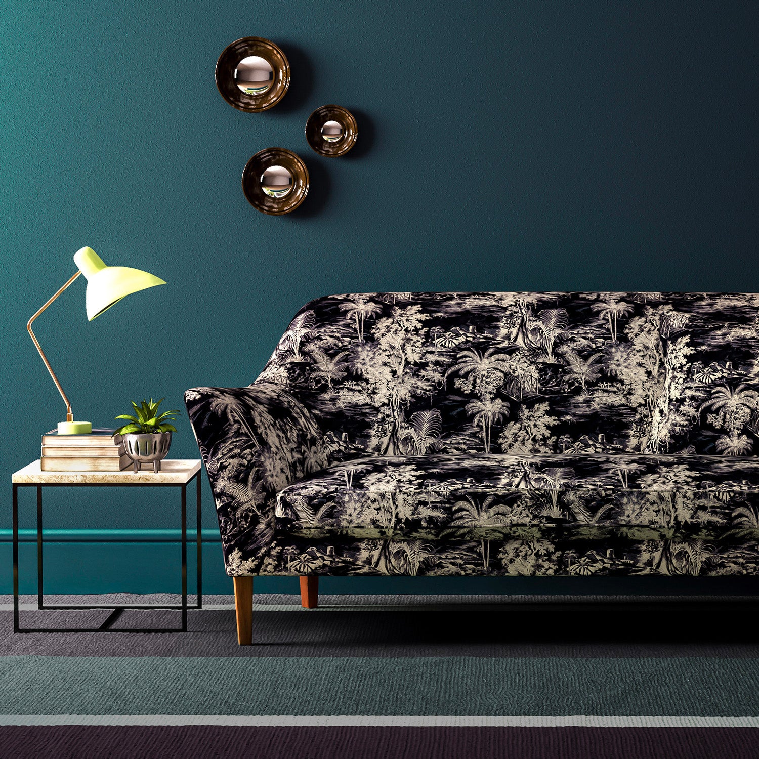 Sofa covered in a printed velvet fabric featuring a rich, tropical-style toile in dark grey.