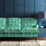 Sofa covered in a printed velvet upholstery fabric featuring a fun, jazzy pattern in Seagreen.