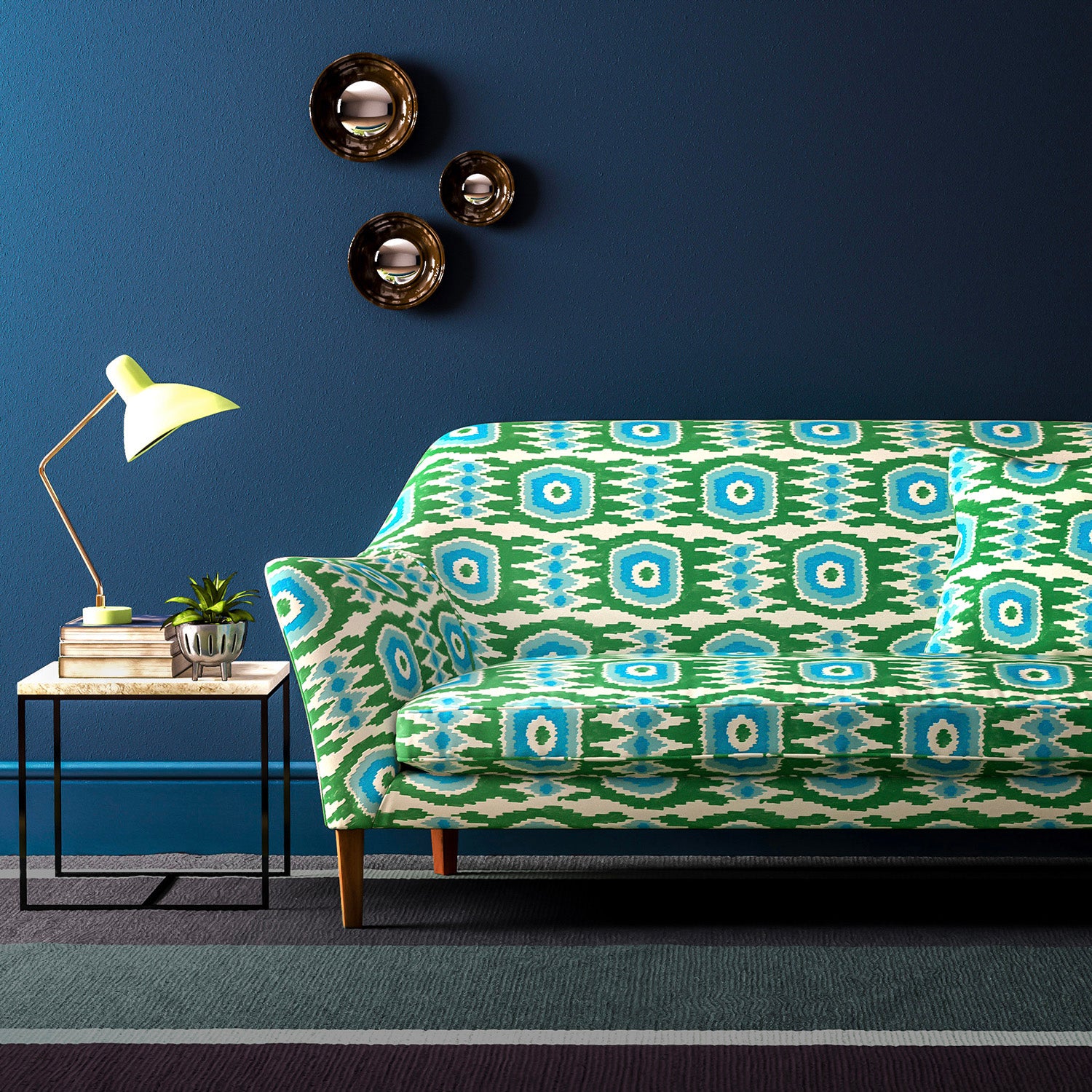 Sofa covered in a printed velvet upholstery fabric featuring a fun, jazzy pattern in Seagreen.