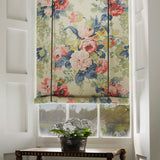 Blind in a printed linen fabric showcasing bouquets of roses in gentle pinks and reds.
