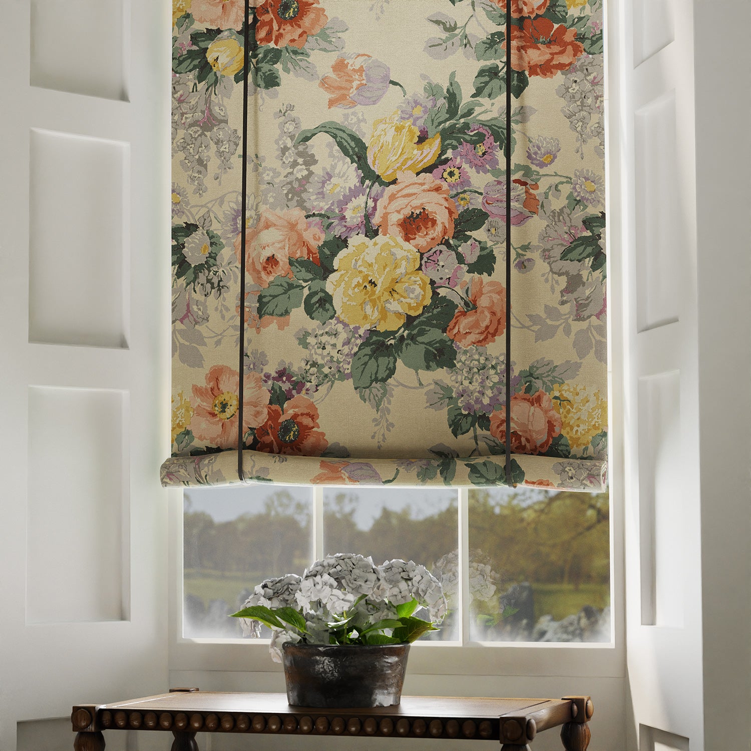 Blind in a printed linen fabric with bouquets of roses on a tea-stained background.