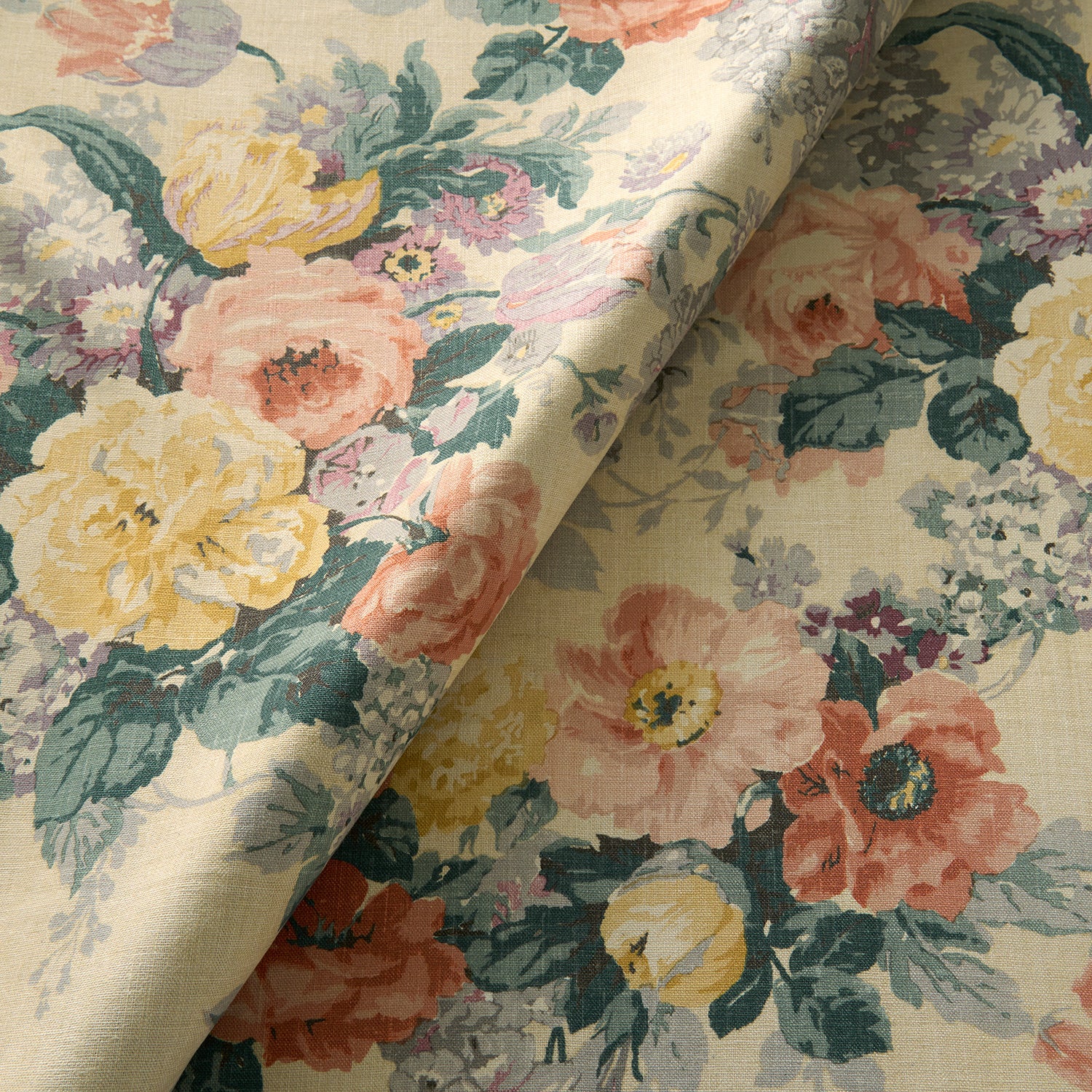 Printed linen fabric with bouquets of roses on a tea-stained background.