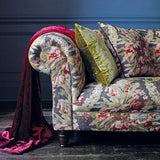 Sofa upholstered in a luxury dark blue and pink floral bouquet fabric