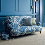 Sofa upholstered in a luxury blue floral damask fabric
