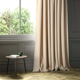 A cream woven fabric shown as a curtain.