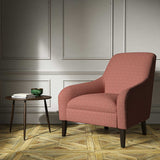 A red woven fabric on an armchair.