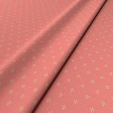 Sample of a pink woven fabric.