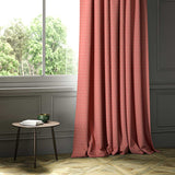 A pink woven fabric shown as a curtain.