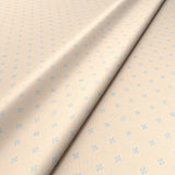 Sample of a cream woven fabric.