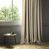 A cream woven fabric shown as a curtain.