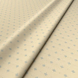 Sample of a cream woven fabric.