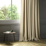A cream woven fabric shown as a curtain.