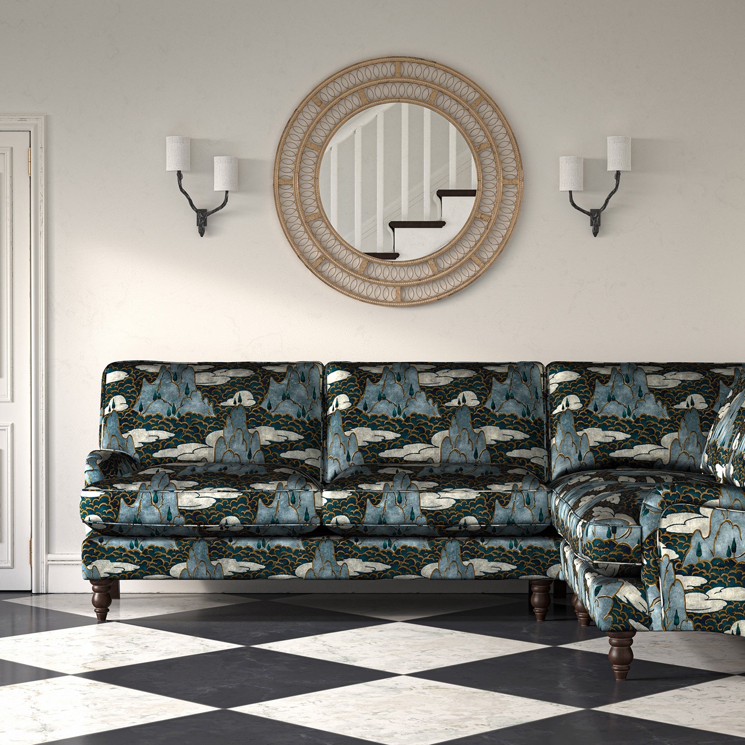 Velvet sofa upholstered in a printed velvet fabric with a scenic landscape design in blue colours.