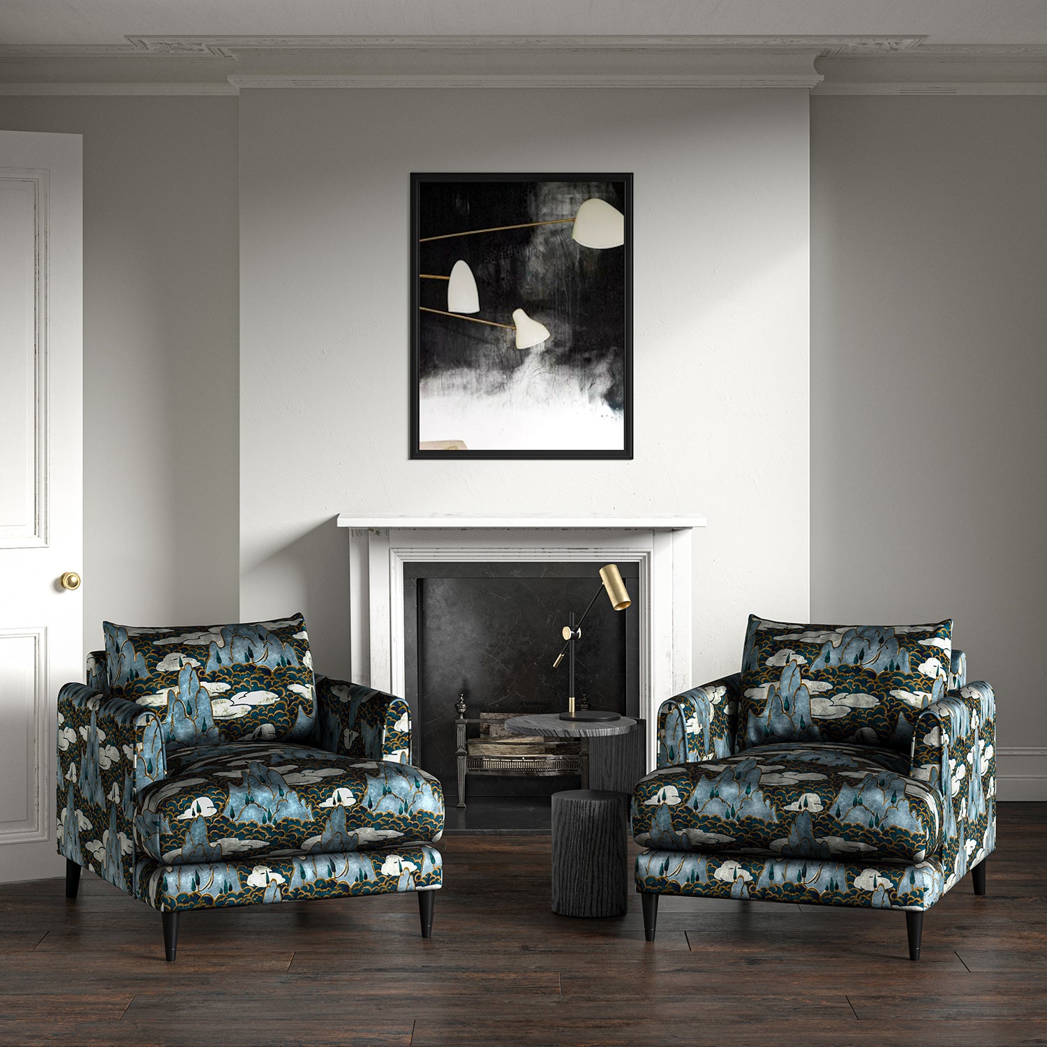 Velvet armchairs upholstered in a printed velvet fabric with a scenic landscape design in blue colours.