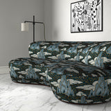 Velvet sofa upholstered in a printed velvet fabric with a scenic landscape design in blue colours.