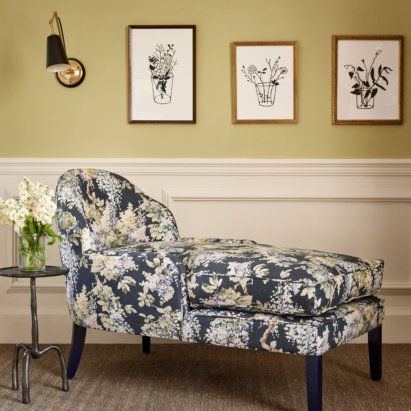 Chair in a printed linen fabric with a wisteria floral pattern in blue and green colours.