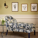 Chair in a printed linen fabric with a wisteria floral pattern in blue and green colours.