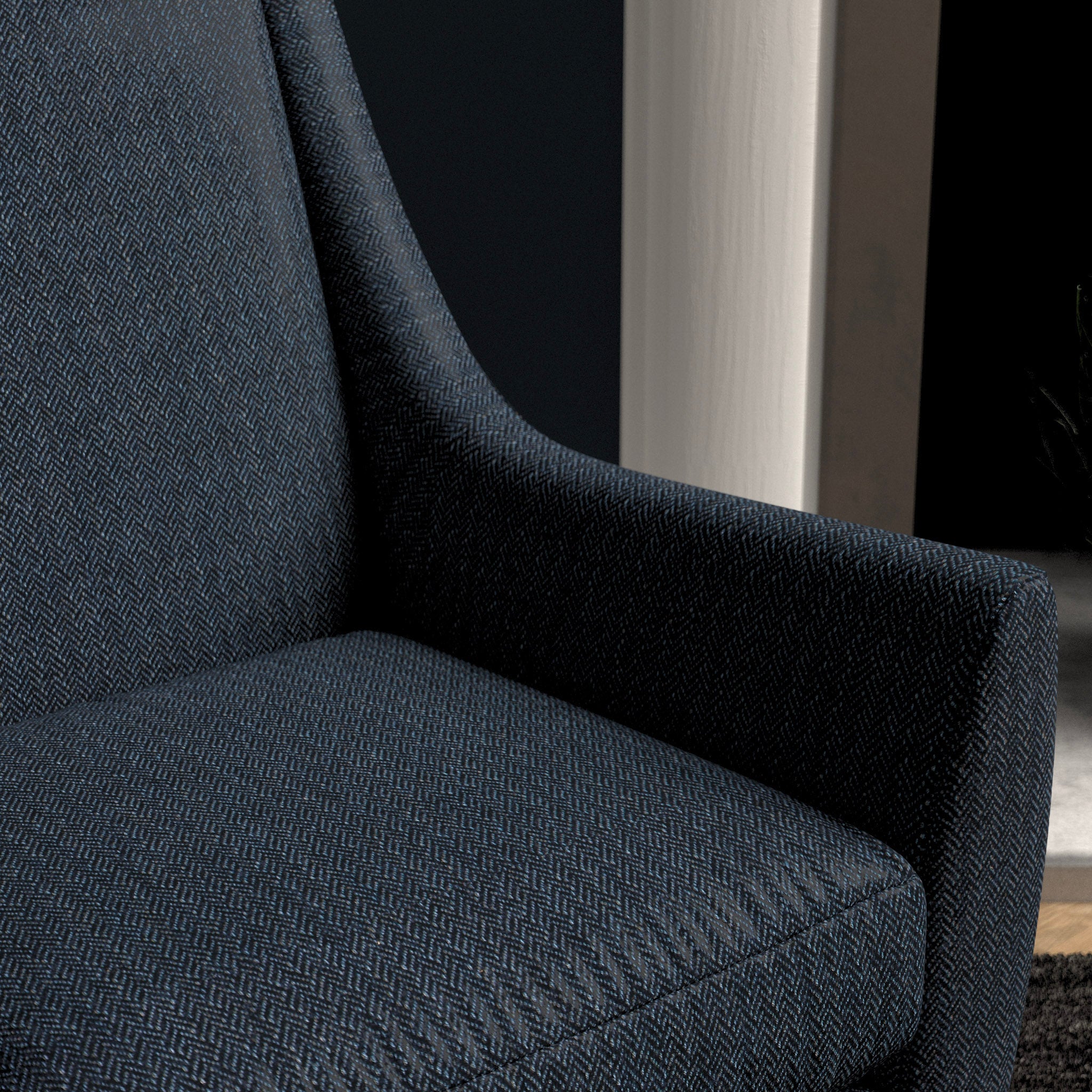 Chair upholstered in a navy herringbone wool weave upholstery fabric