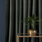 Curtain in a dark blue herringbone wool fabric