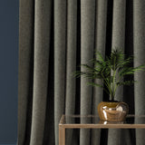 Curtain in a charcoal grey herringbone wool fabric