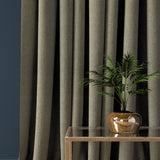 Curtain in a brown-grey herringbone wool fabric