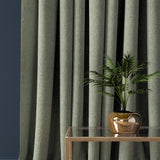Curtain in a dark grey herringbone wool fabric
