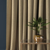 Curtain in a sand coloured herringbone wool fabric