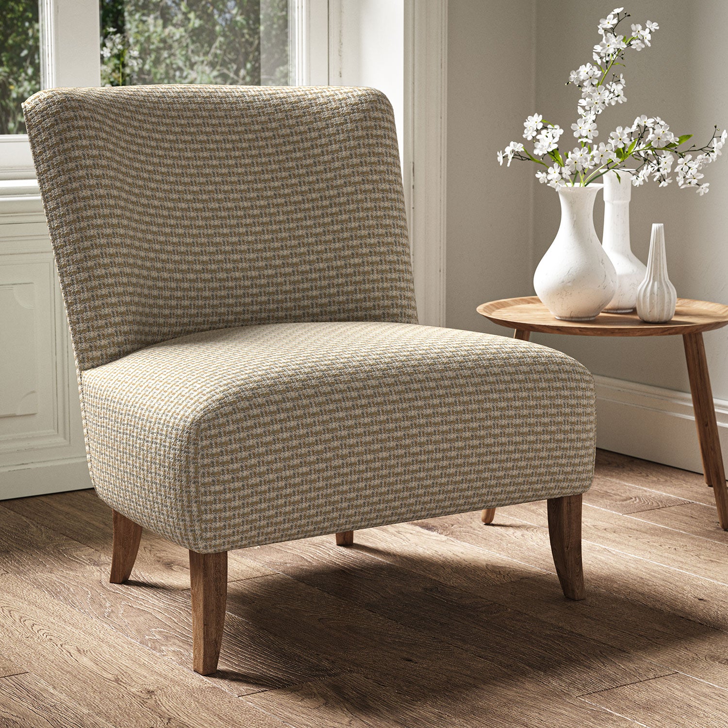 Armchair in a printed linen fabric with textural weave pattern in beige colours.