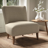 Armchair in a printed linen fabric with textural weave pattern in beige colours.