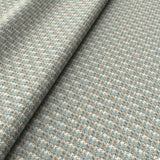 Printed linen fabric with textural weave pattern in brown and blue colours for upholstery.