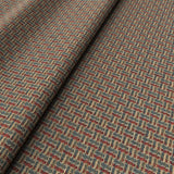 Printed linen fabric with textural weave pattern in red, blue and yellow colours for upholstery.
