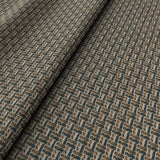 Printed linen fabric with textural weave pattern in brown colours for upholstery.
