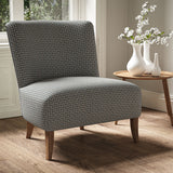 Armchair in a printed linen fabric with textural weave pattern in brown, pink and blue colours.