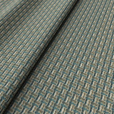 Printed linen fabric with textural weave pattern in brown and blue colours for upholstery.