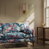 Sofa upholstered in a vibrant tropical floral linen fabric