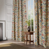 Curtains in a printed linen fabric with tree of life design in multicolours.