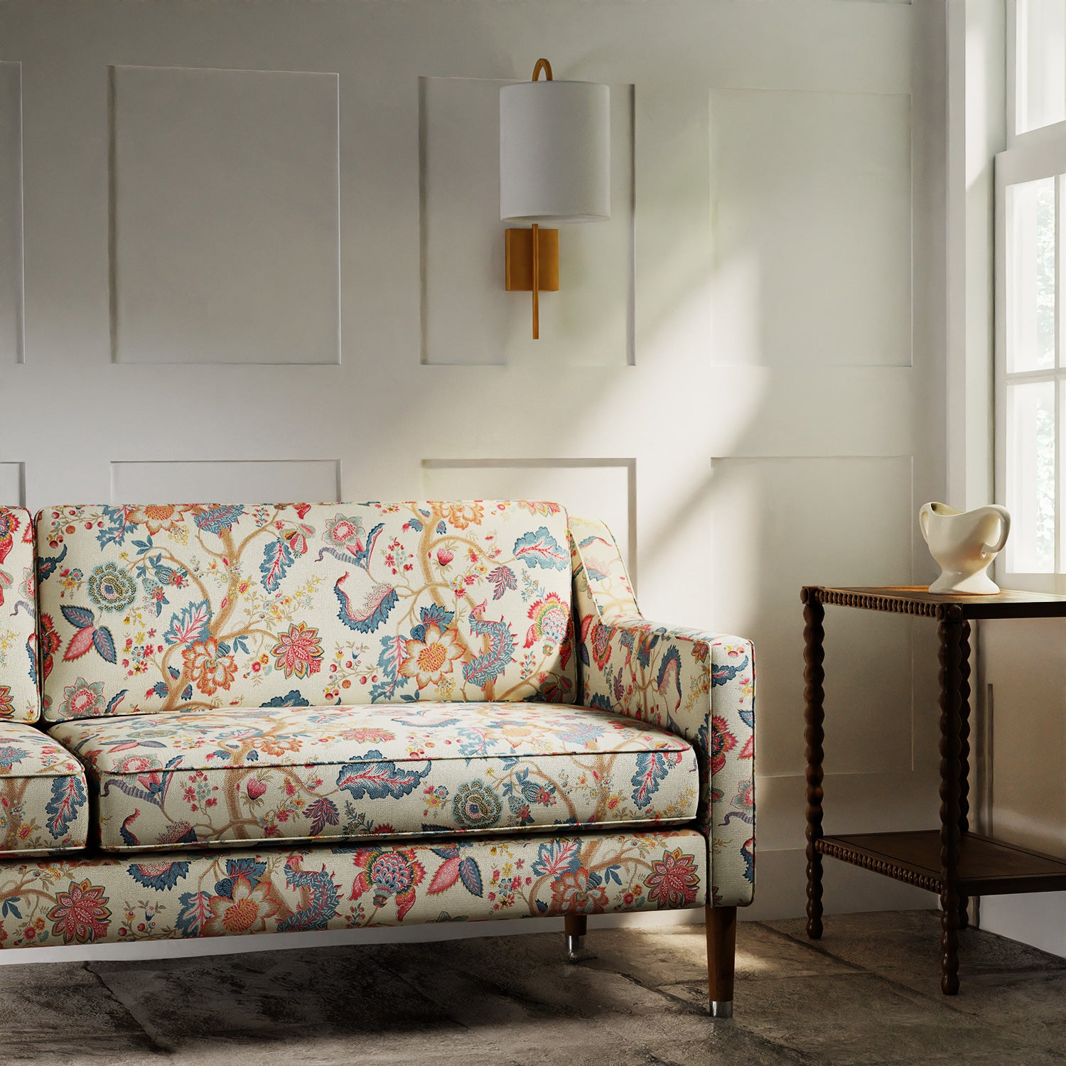 Sofa in a printed linen fabric with tree of life design in multicolours.
