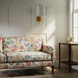 Sofa in a printed linen fabric with tree of life design in multicolours.